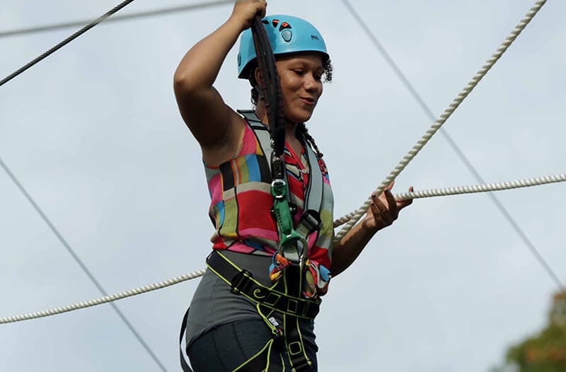 Smiling girl on the adventure park course